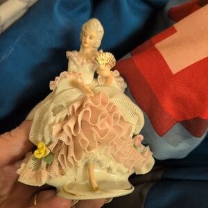Elegant Porcelain Figurine with Pink and Yellow Accents